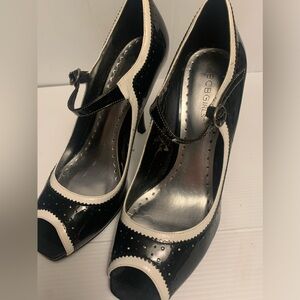 BCBGirls black and white 3” heals,leather,size 8,buckle on front,open toe